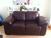 Brown leather 2 seater sofa for sale.